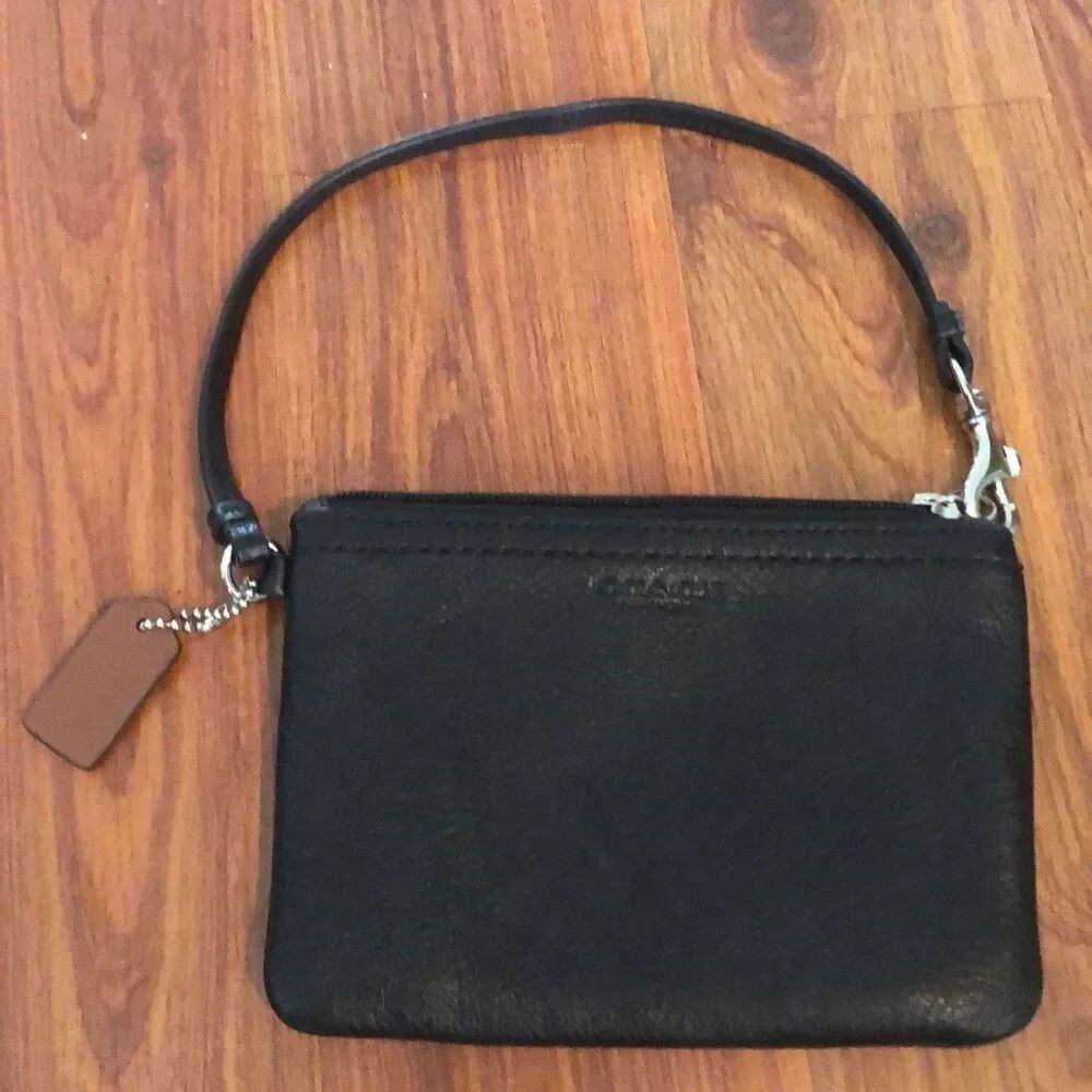COACH Black leather wristlet with brown tag